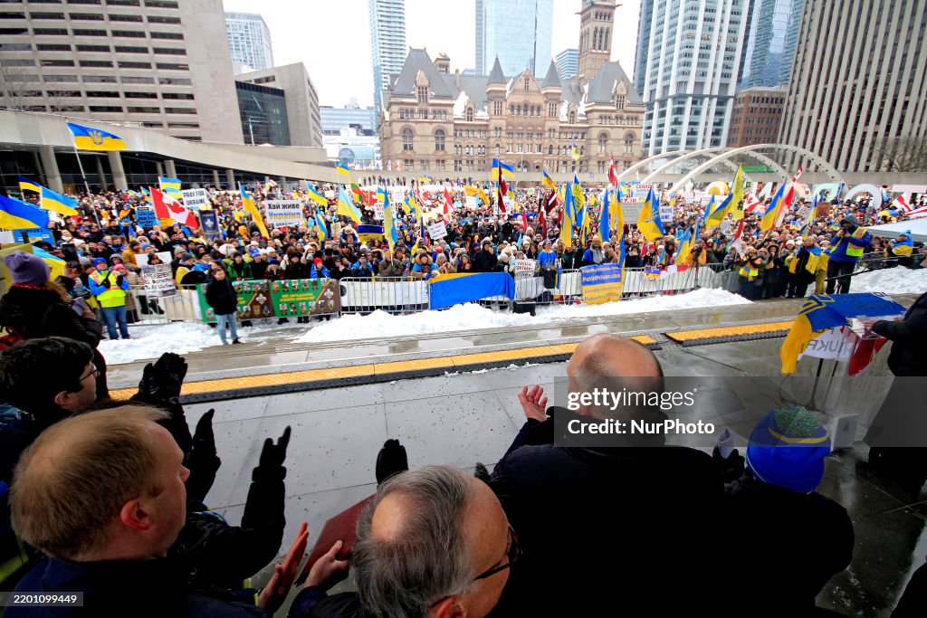 Toronto Ukraine Rally Speakers stand on stage and address a large crowd during a rally to ...