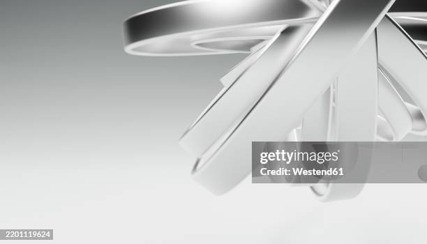 abstract 3d render of interlocking metallic rings in white background - interlocking shapes stock illustrations