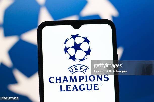 In this photo illustration, the UEFA Champions League logo is seen displayed on a smartphone screen.
