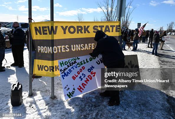 Caag Post Striking correction officers and their supporters post signs along ...
