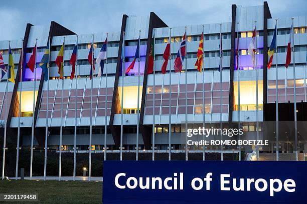 This photograph shows the Council of Europe building illuminated in the colours of the Ukrainian flag for the third anniversary of Russia's invasion...