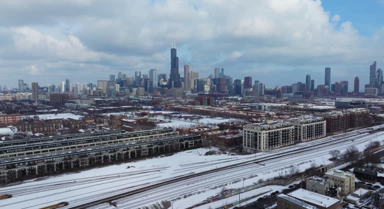 https://media.gettyimages.com/id/2201182696/video/establishing-aerial-flight-above-chicagos-pilsen-neighborhood-on-winter-day.jpg?b=1&s=640x640&k=20&c=UTxrH02Ldb0Sx8h_uSSegNPQNx9MJl5rQQB5Ve1s-3Y=