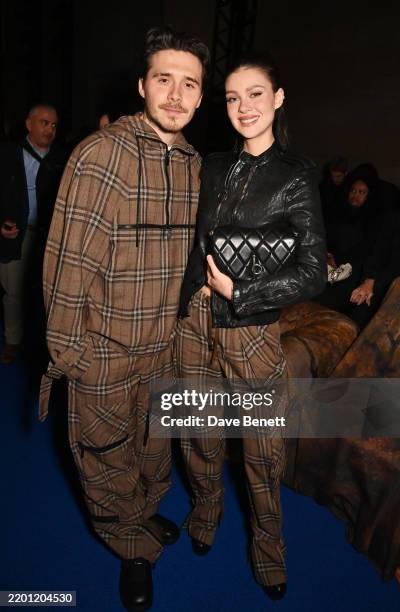 Brooklyn Beckham and Nicola Peltz attend the Burberry Winter 2025 show during London Fashion Week on February 24, 2025 in London, England.