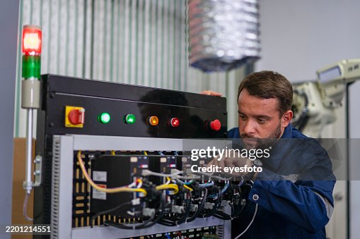 Engineers are working at robotics workshop. Engineers are working at robotics workshop.