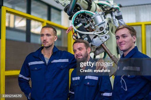 Engineers are working at robotics workshop. Engineers are working at robotics workshop.