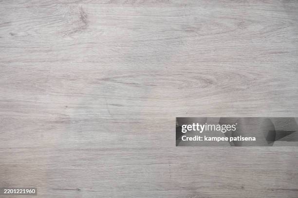 a wooden surface with a grain pattern - walnut texture stock pictures, royalty-free photos & images