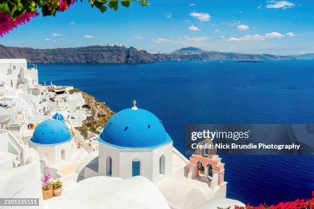oia blue dome churches, santorini, greece - mediterranean-blue-roof-santorini stock pictures, royalty-free photos & images