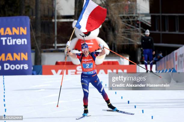Julia Simon of Team France celebrates as she approaches the finish line to win the Women's 4x6km Relay of the IBU World Championships Biathlon...