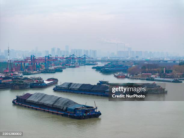 Cargo ships transport coal on the Huaian section of the Subei Canal in Huai'an City, Jiangsu Province, China, on February 25, 2025.
