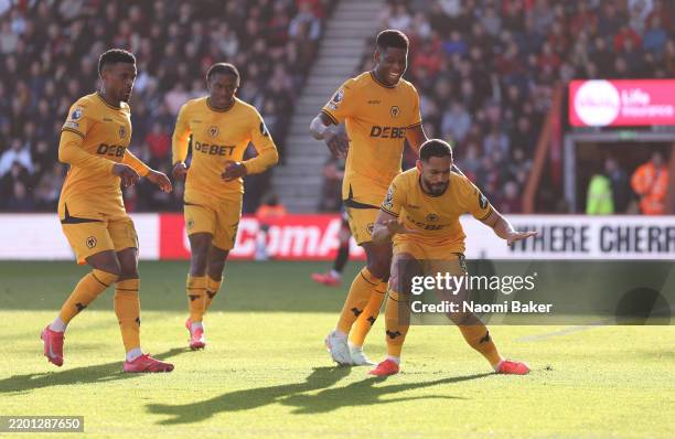 Matheus Cunha of Wolverhampton Wanderers celebrates scoring his team's first goal with teammates during the Premier League match between AFC...