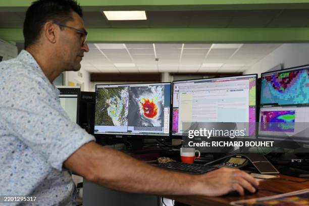 Meteo-France operational meteorologist monitors cyclone "Garance" in Saint-Denis de la Reunion on February 25, 2025. La Reunion is under a cyclonic...