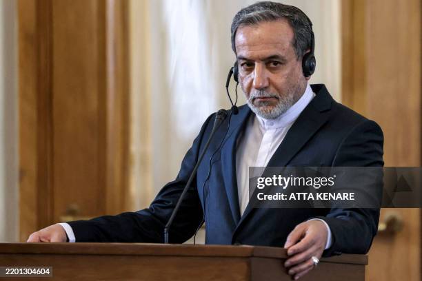 Iran's Foreign Minister Abbas Araghchi gives a joint press conference with Russia's Foreign Minister at the foreign ministry headquarters in Tehran...