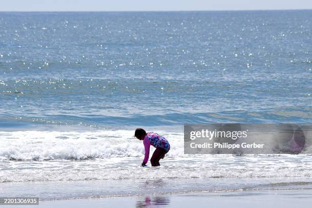 6-year old girl playing in water at beach - people at jersey shore stock pictures, royalty-free photos & images
