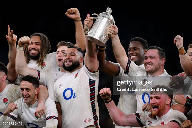 Ellis Genge, Maro Itoje and Jamie George of England lift the Calcutta Cup trophy after the team's victory during the Guinness Six Nations 2025 match...