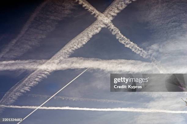 chemtrail spraying from aircraft - conspiracy theory stock pictures, royalty-free photos & images