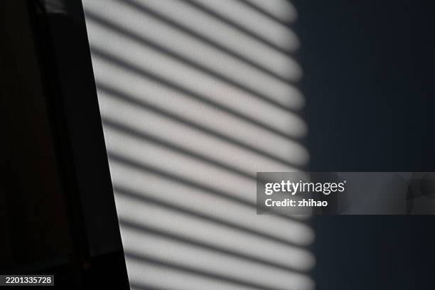 abstract shadow play on wall - blinds shadow stock pictures, royalty-free photos & images