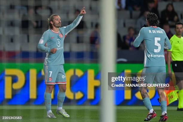 Atletico Madrid's French forward Antoine Griezmann celebrates scoring their second goal during the Spanish Copa del Rey semi-final first leg football...