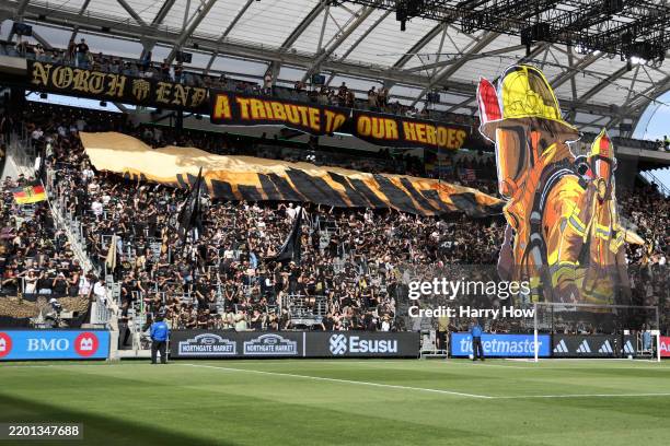 Fans display a tribute to LA firefighters before the MLS match between Los Angeles Football Club and Minnesota United FC at BMO Stadium on February...