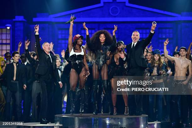 Rappers Doechii and JT perform with Canadian fashion designers Dean and Dan Caten, British super model Naomi Campbell after the presentation of a...