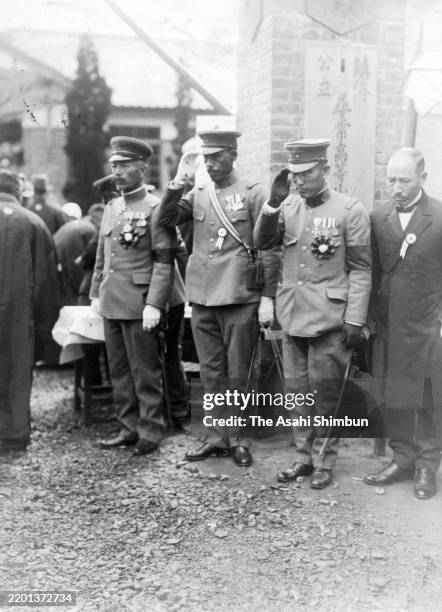 Imperial Japanese Navy Jinhae Naval Base Commander Gennosuke Sakurai salutes during the joint funeral after a gas explosion kills 104 elementary...