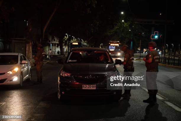 Chilean police carry out controls during curfew after massive power outage that left almost 20 million people without electricity in Santiago, Chile...