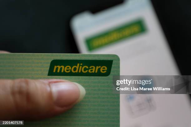 In this photo illustration, the Australian Medicare smartphone app and medicare card are seen on February 23, 2025 in Sydney, Australia. Prime...