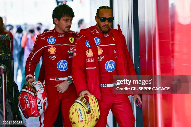 Ferrari's British driver Lewis Hamilton and his teammate Monegasque driver Charles Leclerc arrive at the circuit on the first day of the Formula One...
