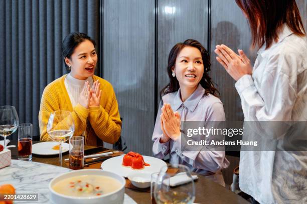 heartwarming birthday surprise among friends. - east asia stock pictures, royalty-free photos & images