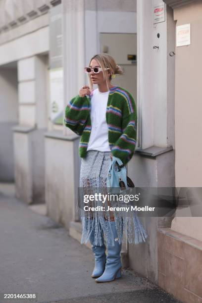 Karin Teigl seen wearing Loewe light pink sunglasses, Viktoria Louise white cotton basic shirt, Moluv by Mors green with colorful stripes mohair wool...
