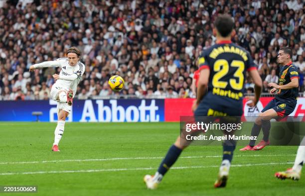 Luka Modric of Real Madrid scores his team's first goal during the LaLiga match between Real Madrid CF and Girona FC at Estadio Santiago Bernabeu on...