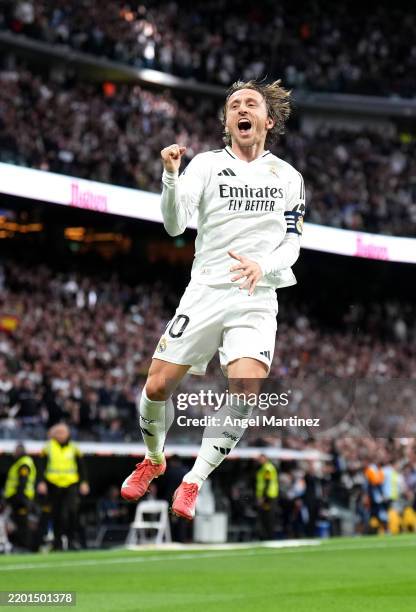 Luka Modric of Real Madrid celebrates scoring his team's first goal during the LaLiga match between Real Madrid CF and Girona FC at Estadio Santiago...