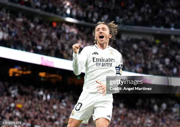 Luka Modric of Real Madrid celebrates scoring his team's first goal during the LaLiga match between Real Madrid CF and Girona FC at Estadio Santiago...