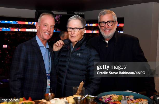 Chief Executive Officer for the Boston Bruins, Charlie Jacobs, Boston Red Sox oner, John Henry and President of the Boston Bruins, Cam Neely, pose...