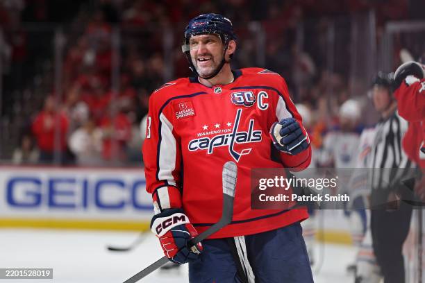 Alex Ovechkin of the Washington Capitals celebrates after teammate Jakob Chychrun scored a goal against the Edmonton Oilers during the first period...