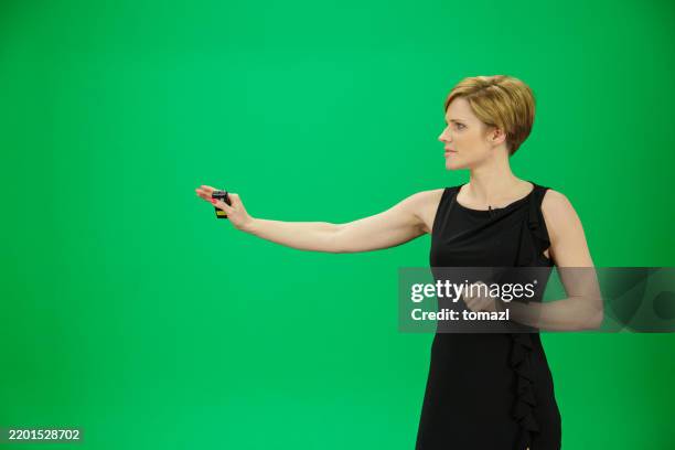 weather forecaster on green background - weather forecaster stock pictures, royalty-free photos & images