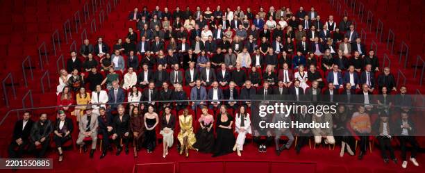 In this handout image provided by A.M.P.A.S., nominees for the 97th Oscars pose for a group photo at a dinner held at the Academy Museum on February...