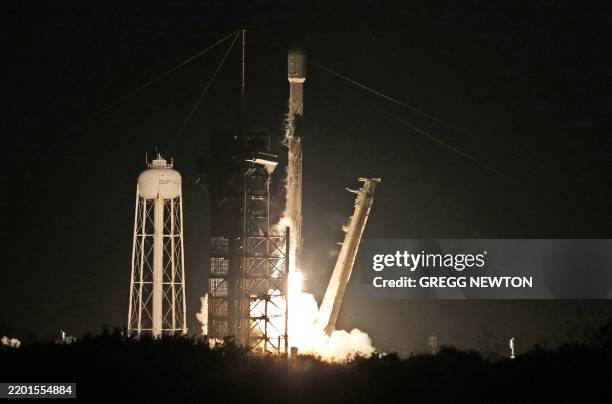 Intuitive Machines' Athena lander on top of a SpaceX Falcon 9 rocket, launches toward the moon from Launch Complex 39A at NASA's Kennedy Space...