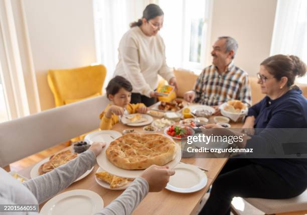 turkish family eating breakfast at home - iftar stock pictures, royalty-free photos & images