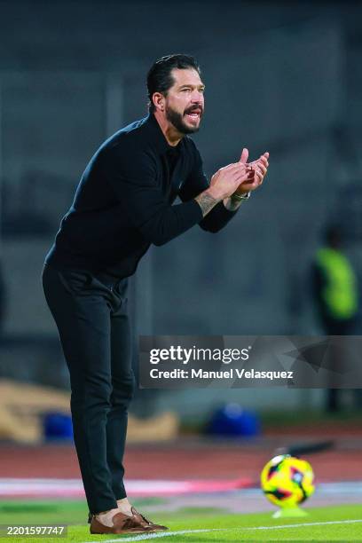 Head coach Benjamin Mora of Queretaro gives the team instructions during the 8th round match between Cruz Azul and Queretaro as part of the Torneo...