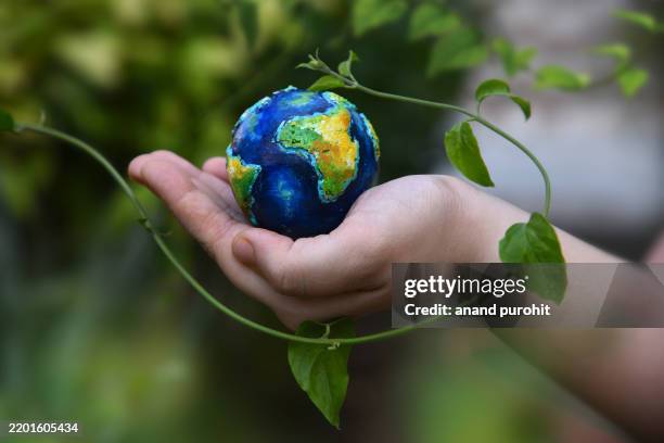 save earth for future generations - action climatique photos et images de collection