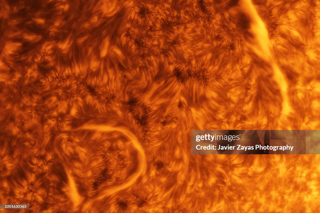 Our Sun in H-alpha Light. Sun surface emitting h-alpha light showing swirling plasma and filaments