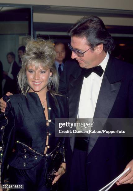 British glamour model and singer Samantha Fox with radio DJ Jonathan King attending the 40th BAFTA Awards in London, England on 22 March, 1987.