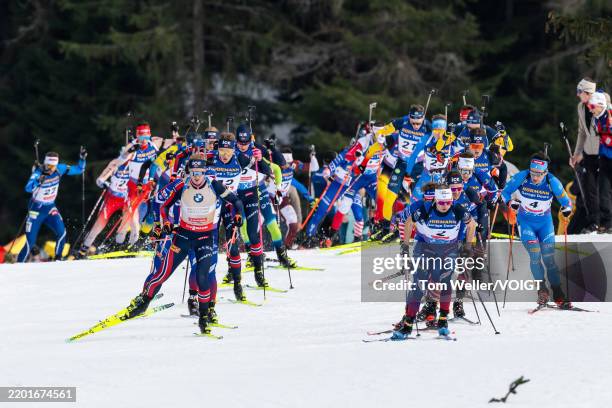 Johannes Thingnes Boe of Norway and Eric Perrot of France leads bunch in action during the Men 15 km Mass Start at the IBU World Championships...