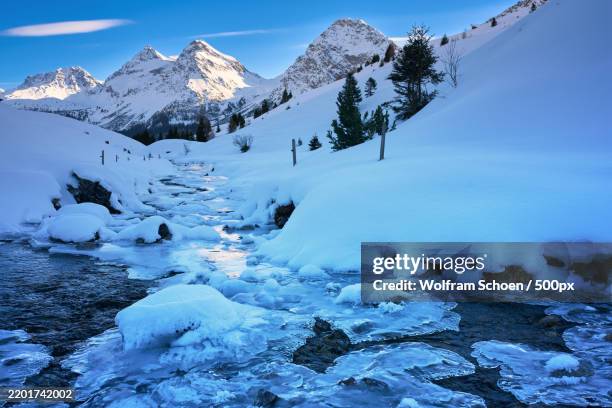 scenic view of snowcapped mountains against sky - arosa stock pictures, royalty-free photos & images