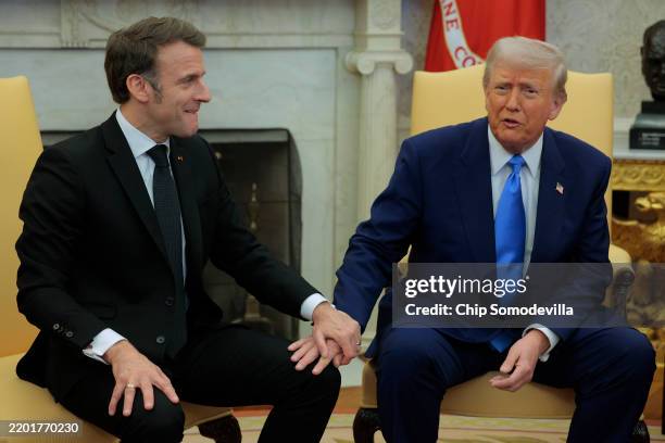 President Donald Trump hosts French President Emmanuel Macron as they answer questions from journalists in the Oval Office at the White House on...