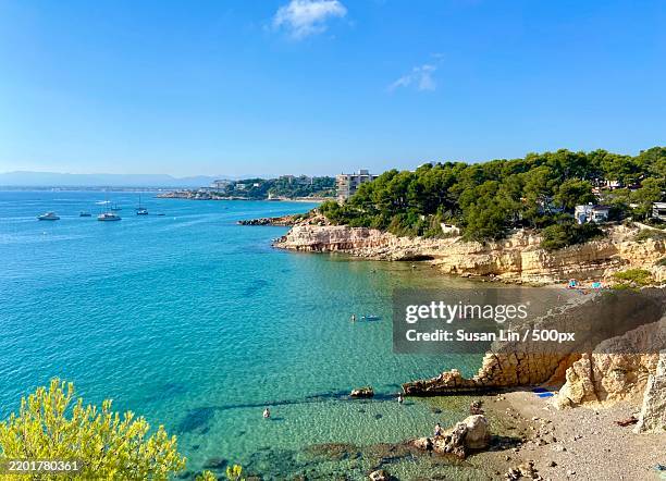 scenic view of sea against blue sky,salou,tarragona,spain - tarragona imagens e fotografias de stock