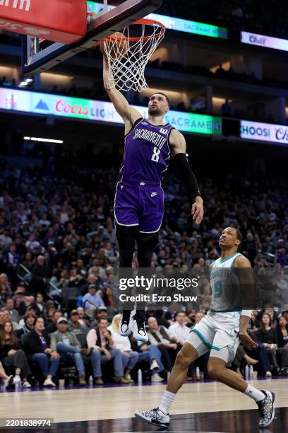 Zach LaVine of the Sacramento Kings dunks the ball on Wendell Moore Jr. Of the Charlotte Hornets during the second half at Golden 1 Center on...