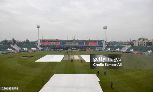 General view inside the stadium as covers are seen over the field ahead of the ICC Champions Trophy 2025 match between Australia and South Africa at...