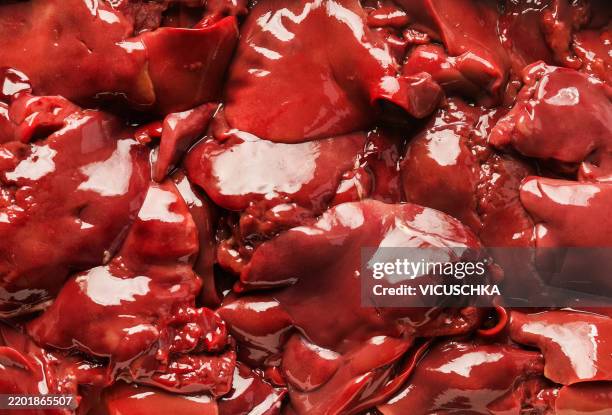 raw chicken liver background - offal stock pictures, royalty-free photos & images