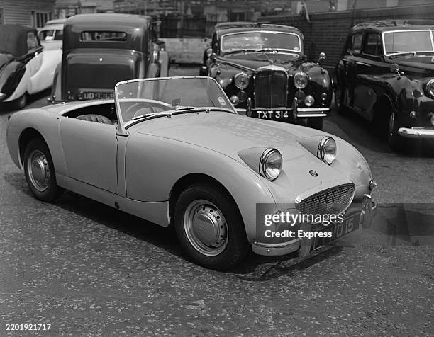 Parked Austin-Healey Sprite convertible sports car, June 18th 1958.
